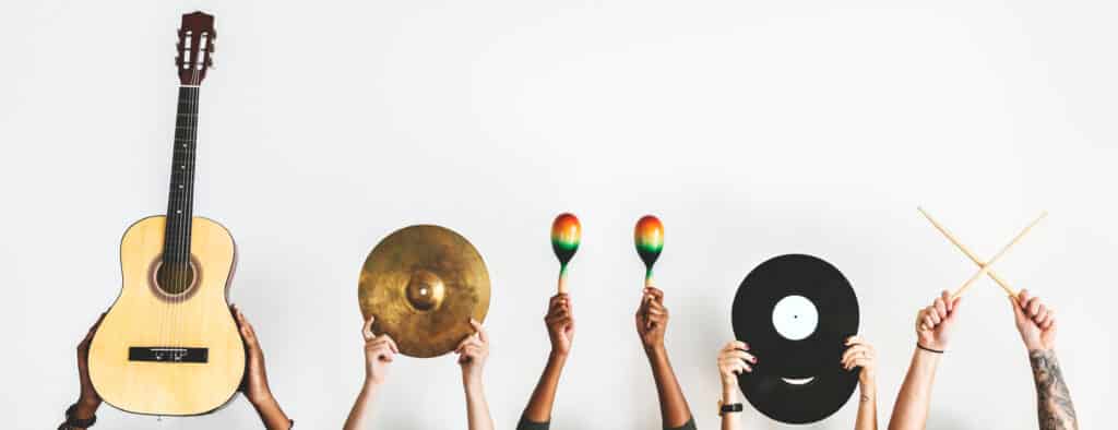 Hands holding music instruments
